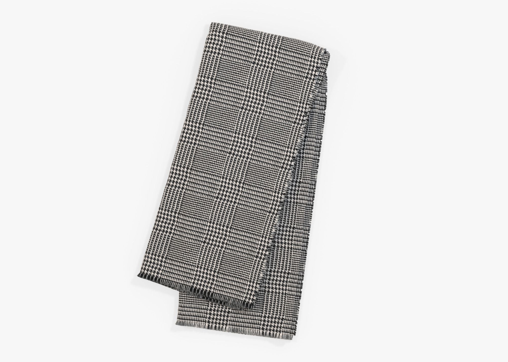 Outdoor throw blanket in Houndstooth pattern that protects you from safely insects, shown folded. #color_Houndstooth